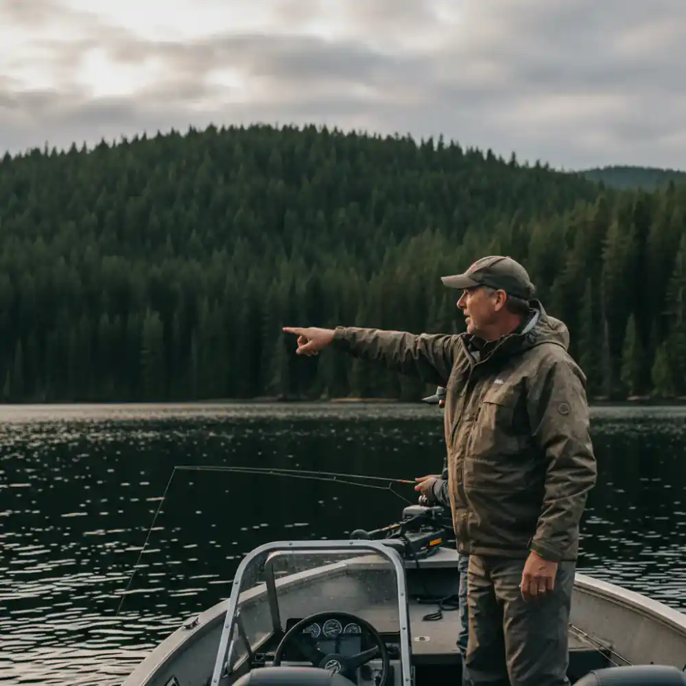 Fishing guide pointing out a spot on the lake